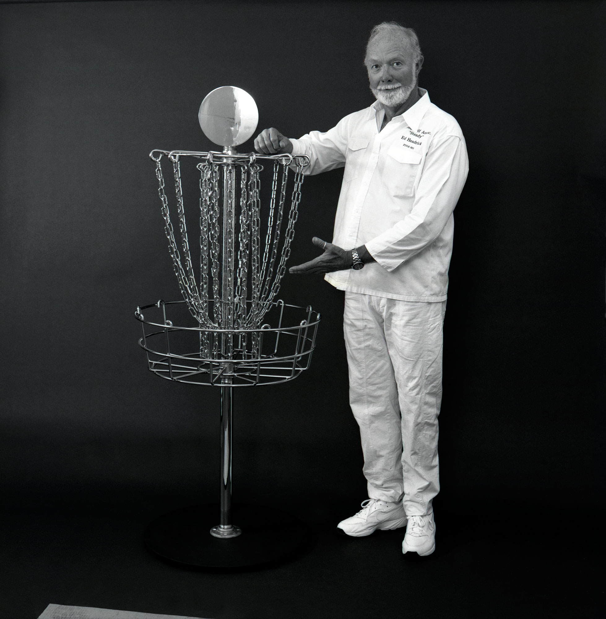 Disc golf basket and chains — the invention of Steady Ed
